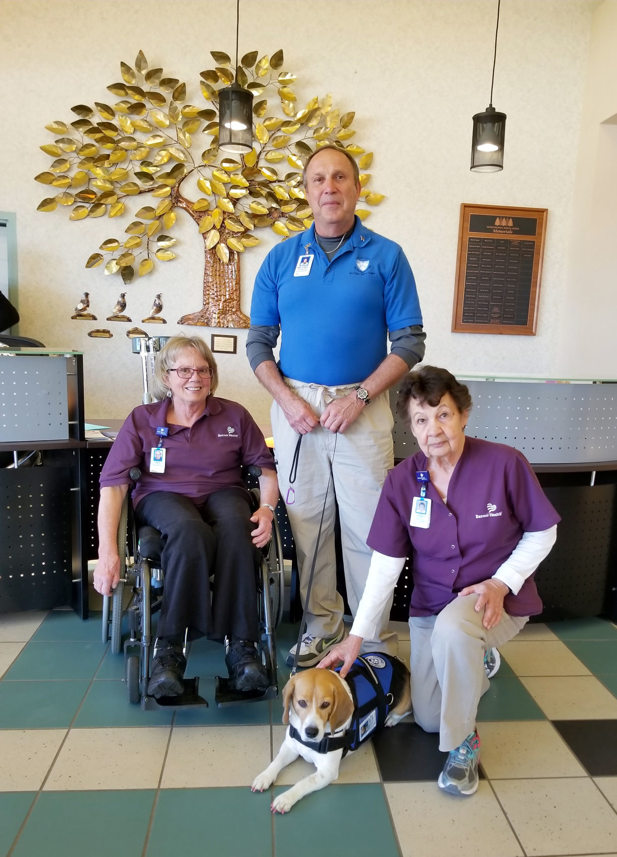Michael Colombo and Shiloh with hospital volunteers